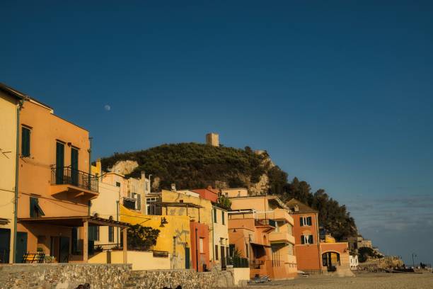 the Etruscan village of Varigotti with its characteristic yellow colored houses the Etruscan village of Varigotti with its characteristic yellow colored houses photographed along the Mediterranean coast varigotti stock pictures, royalty-free photos & images