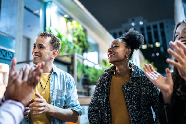 istock Friends having fun outdoors at night 1415621799