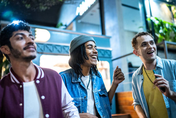 istock Group of friends dancing outside at night 1415622103