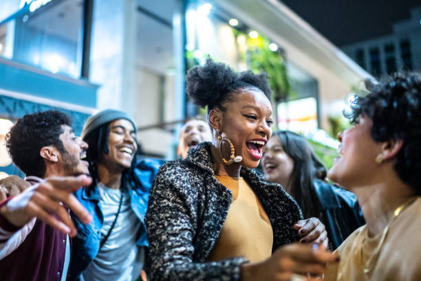 istock Group of friends dancing outside at night 1415622107