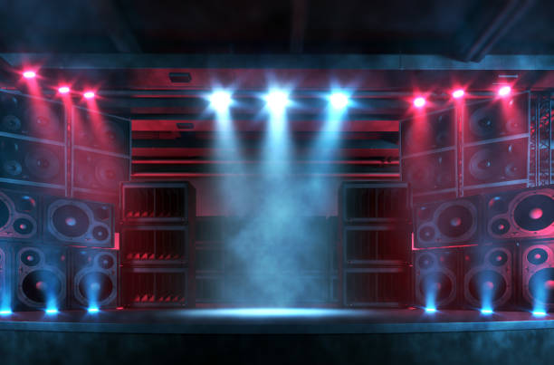 Empty music concert stage illuminated by spotlights, with copy space Empty music concert stage illuminated by bright spotlights, with smoke and flares, surrounded by a large and loud sound system with plenty of loudspeakers. Punk and rock music background with copy space for adding items and characters. Digitally generated concert backdrop. rock n roll music speakers stock pictures, royalty-free photos & images