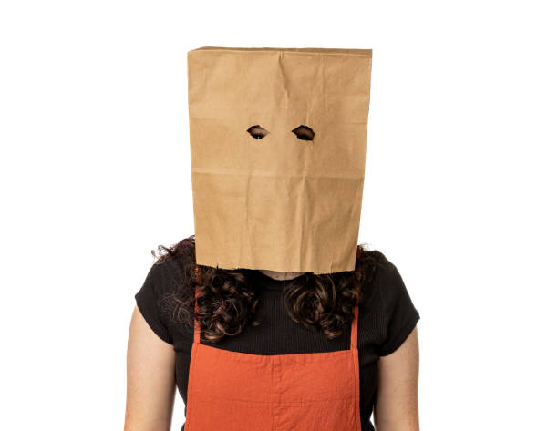 Young woman wearing paper bag over her head