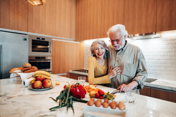 istock couple cooking together in the kitchen 1415625523