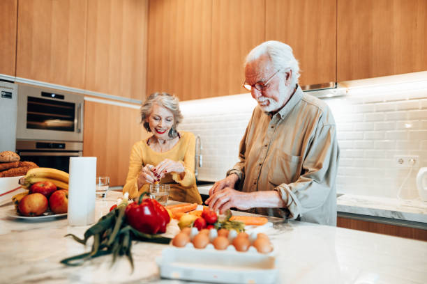 istock couple cooking together in the kitchen 1415625565