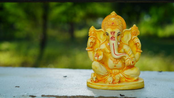 istock Eco friendly Ganesh or Ganpati idol or murti with nature background, home made. selective focus. Ganesha chaturthi festival 2022. 1415627034