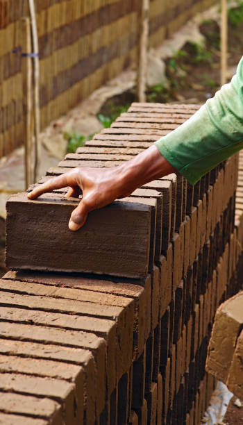 istock pile of raw bricks 1415628474