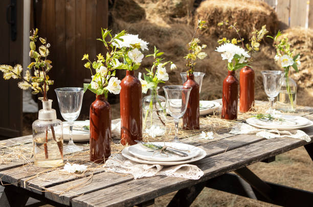 istock set table at a rural wedding. cutlery, plates and glasses 1415628569