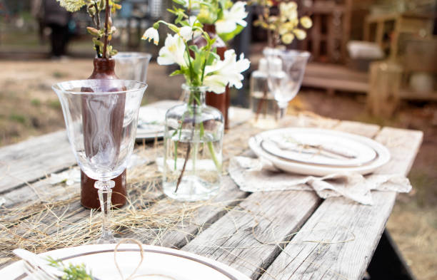 istock set table at a rural wedding. cutlery, plates and glasses 1415628638