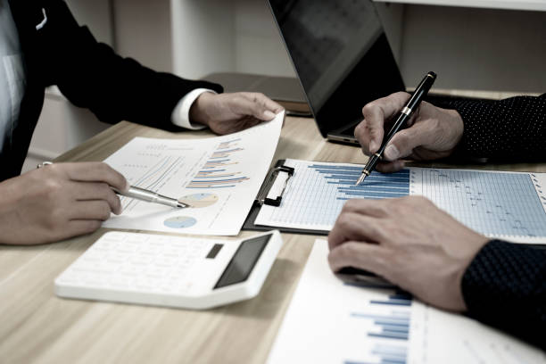 istock Business staff team meeting to create a marketing plan using graphs chart 1415630870