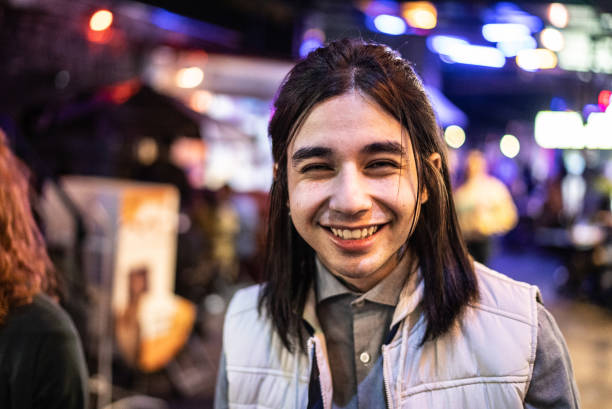istock Portrait of a young man outdoors at night 1415631193