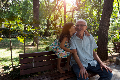 Grandfather and granddaughter spending time together in nature