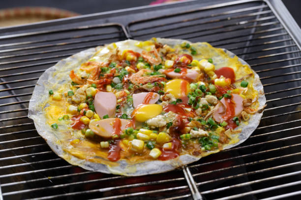 istock Vietnamese rice paper pizza ( Banh Trang Nuong ) 1415633731