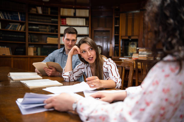 istock Group of students studying together at the University library 1415634948