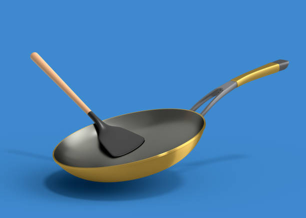 istock Frying pan with glass lid and silicon solid turner on blue background. 1415638411