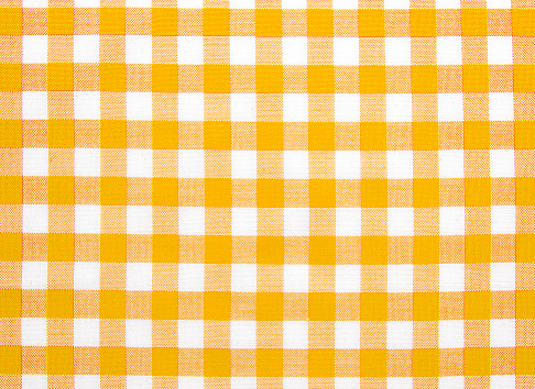 Yellow checkered texture.Picnic cloth background. Checked backdrop.Gingham towel.