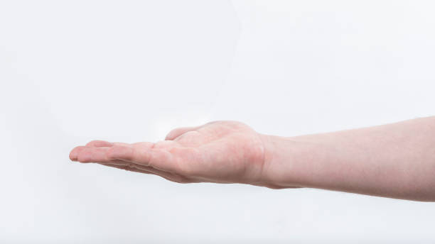 istock outstretched male hand, isolated on white background 1415638840
