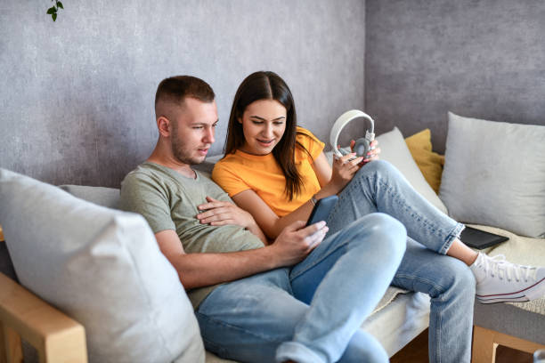istock Couple Exploring Song App On Smartphone 1415639611