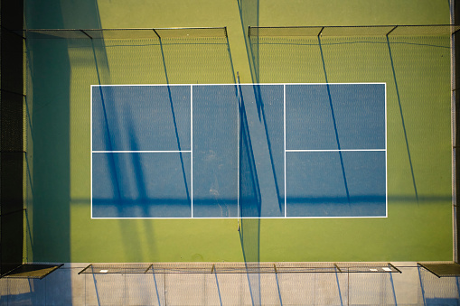 Aerial view of tennis courts in typical Australian suburb