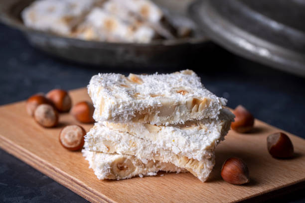istock Traditional delicious Turkish dessert; cezerye with hazelnuts and coconut (Turkish name; Findikli madonna) 1415641607
