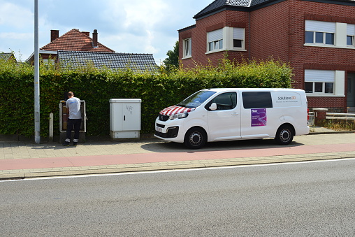 Wilsele, Vlaams-Brabant, Belgium - August 18, 2022: Proximus Belgian telecom operator checking the telephone copper lines in the cable distributor box
