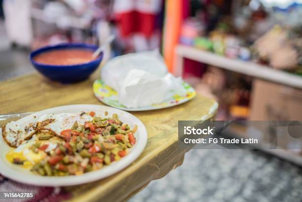 Fried Eggs And Prickly Pear Dish With Tomato Salsa And Cheese Stock Photo - Download Image Now