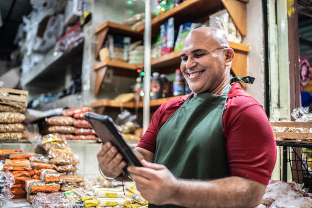 istock Mature man small business owner using digital tablet 1415643328