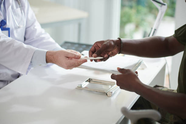 istock Signing Health Insurance Documents 1415644368