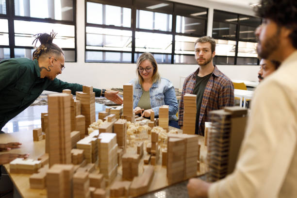 istock Students talking about the city model in front of them 1415644414