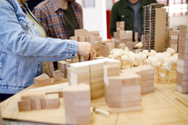 istock Student arranging wooden blocks on the maquette 1415644464