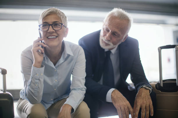 istock Business couple waiting for a train. 1415645316