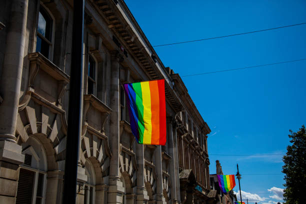 istock LGBTQ Flag on Side of old building 1415647443