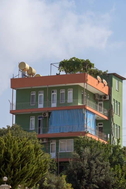 Low-rise apartment building nestled among greenery. Southern architecture.