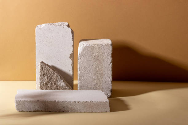 istock Background with geometric shapes made of concrete for cosmetic products. Rectangular podiums with shadows on a beige background. Blank mockup for product packaging presentation 1415648947