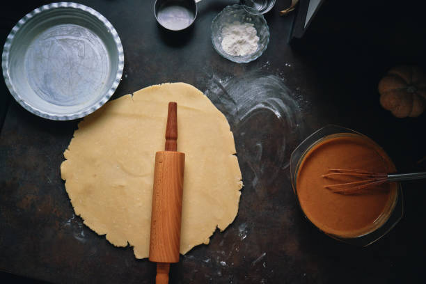 istock Preparing Pumpkin Pie for the Holidays in Domestic Kitchen 1415650484