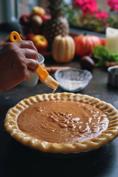 istock Preparing Pumpkin Pie for the Holidays in Domestic Kitchen 1415650524