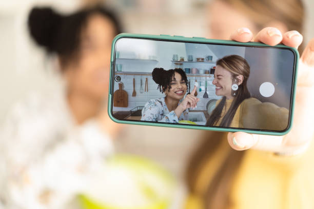 istock Selfie of two girlfriends making a cake and having fun 1415653365