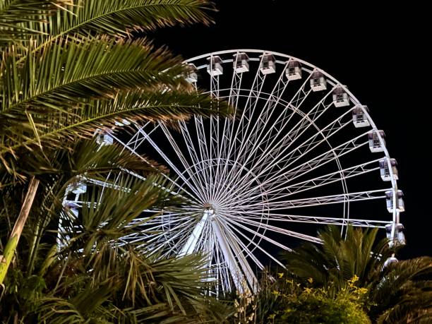 istock A Ferris wheel glowing in the dark. 1415654426