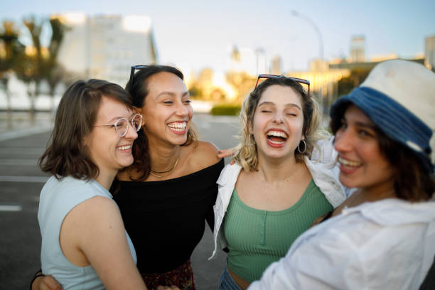istock Group of women laughing together 1415654958