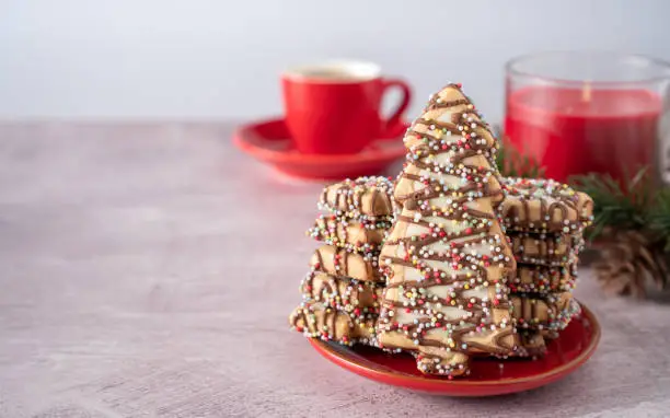 Close-Up of Christmas tree Cookies and Tea on Table with Copy Space Horizontal