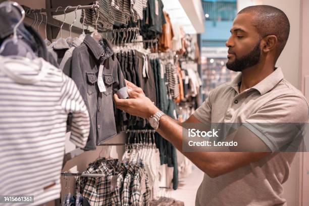 Handsome Mixed Race Father Shopping For Baby Supplies Stock Photo - Download Image Now