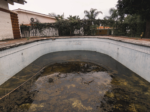 Abandoned pool with dirty water