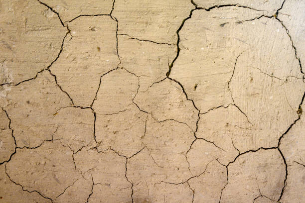 istock dry cracked earth after drought backgrounds and texture 1415668289