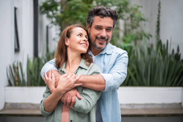 istock Loving couple at home looking very happy 1415670295