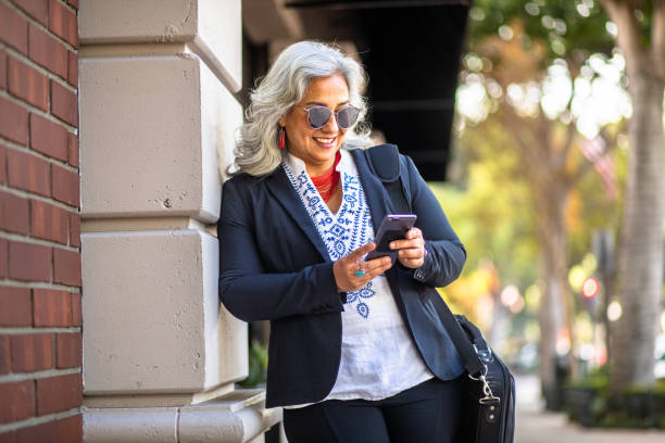 istock Mexican Businesswoman Texting 1415672165