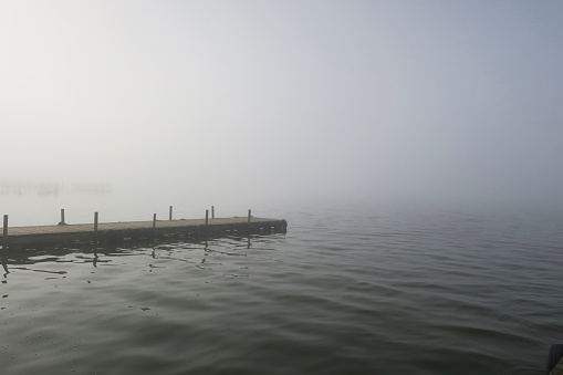 Dock L'albufera in Valencia with mist on foggy morning