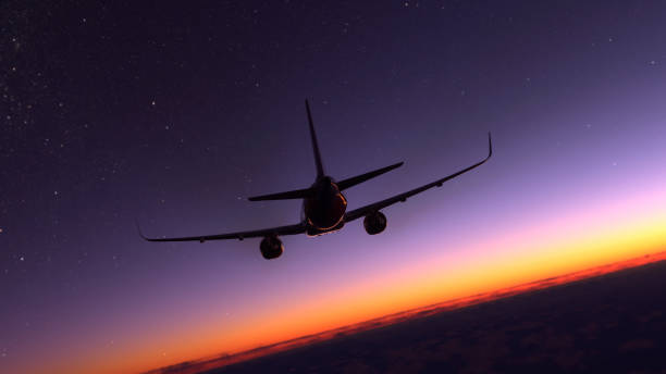 istock Comercial airplane flying over the amazing sunset 1415680642