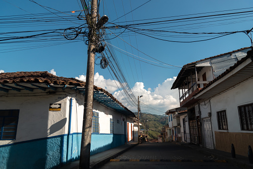 Street of a village with old houses in the department of Cladas. Colombia. February 1. 2022.
