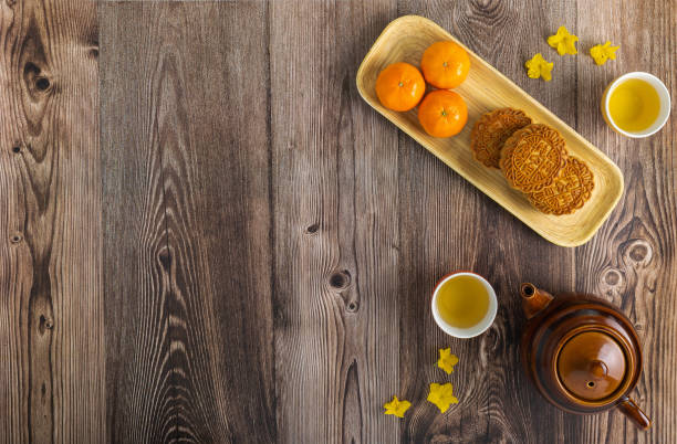 istock 3 moon cakes and 3 tangerines on a bamboo tray 1415693161