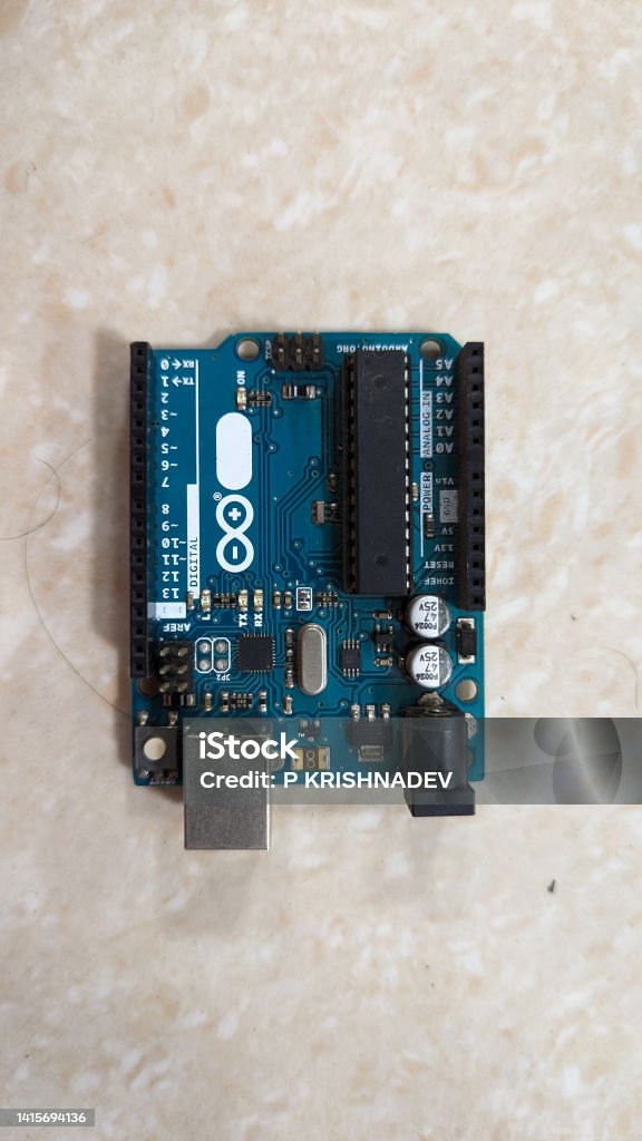 Arduino One microcontroller board Arduino Uno microcontroller board with components and specifications isolated in a plain background Analog Stock Photo