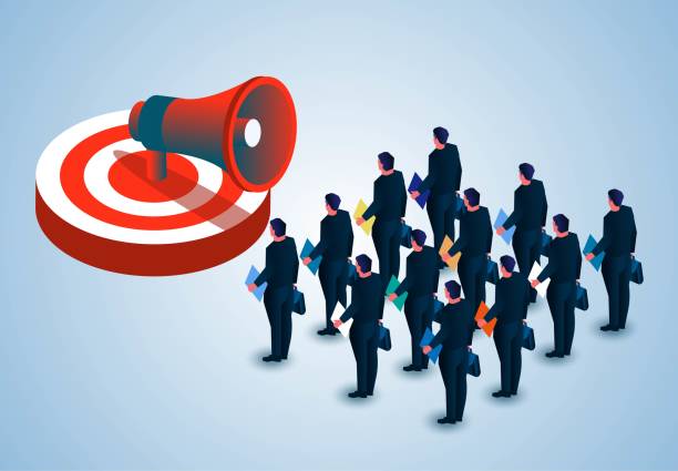 istock White collar workers or clerical workers standing in three rows listening to marketing plans and tasks, isometric group of businessmen with documents standing in front of megaphone on bullseye 1415695492